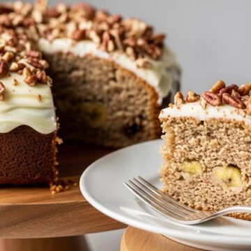 sliced banana bundt cake with pecans