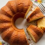 Day-old cream cheese pound cake sliced on a plate
