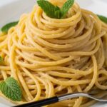 lemon hummus pasta finished dish with herbs