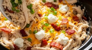 cheesy crack chicken in slow cooker with bacon
