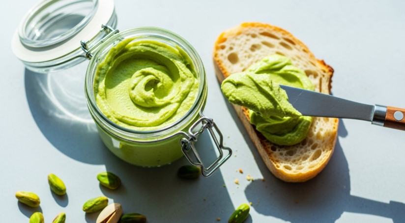 Homemade savory pistachio cream spread on rustic toast