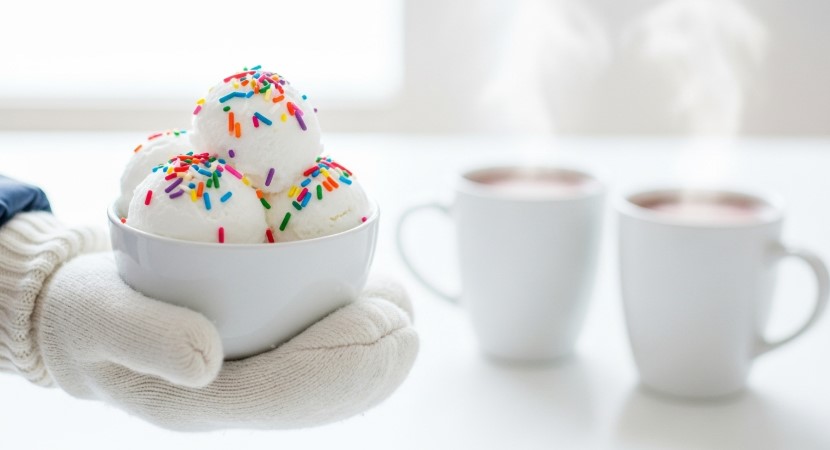 Child holding snow ice cream with sprinkles